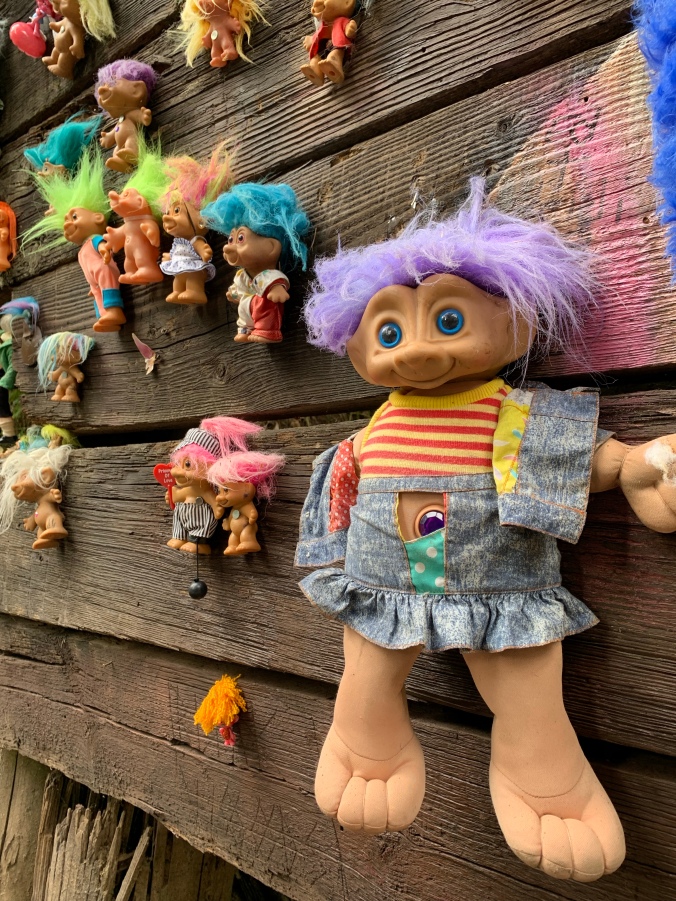Troll toys nailed to Portland Troll bridge