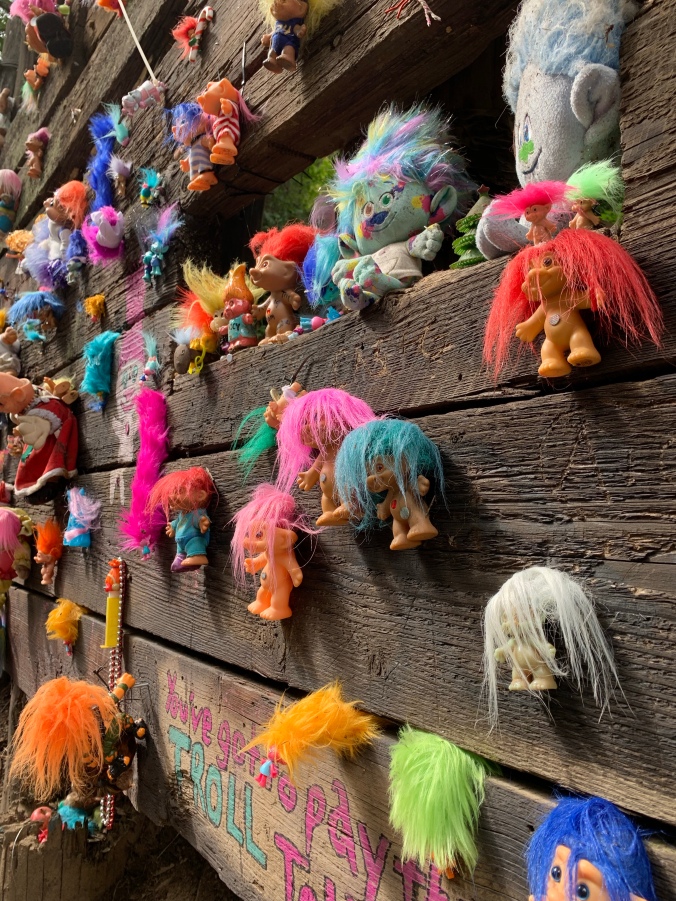 Colorful troll dolls on Portland troll bridge