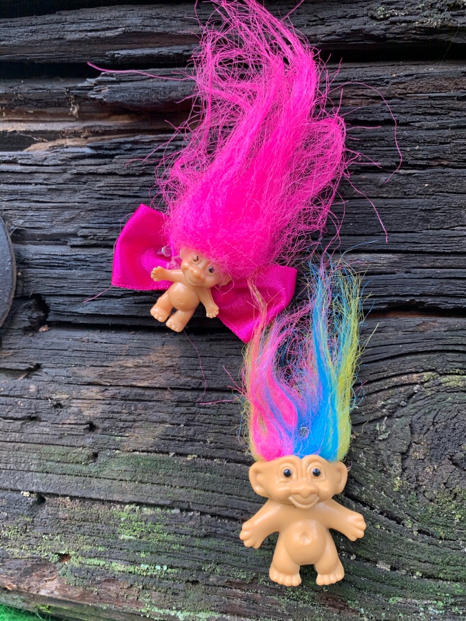 Troll toys nailed to Portland troll bridge